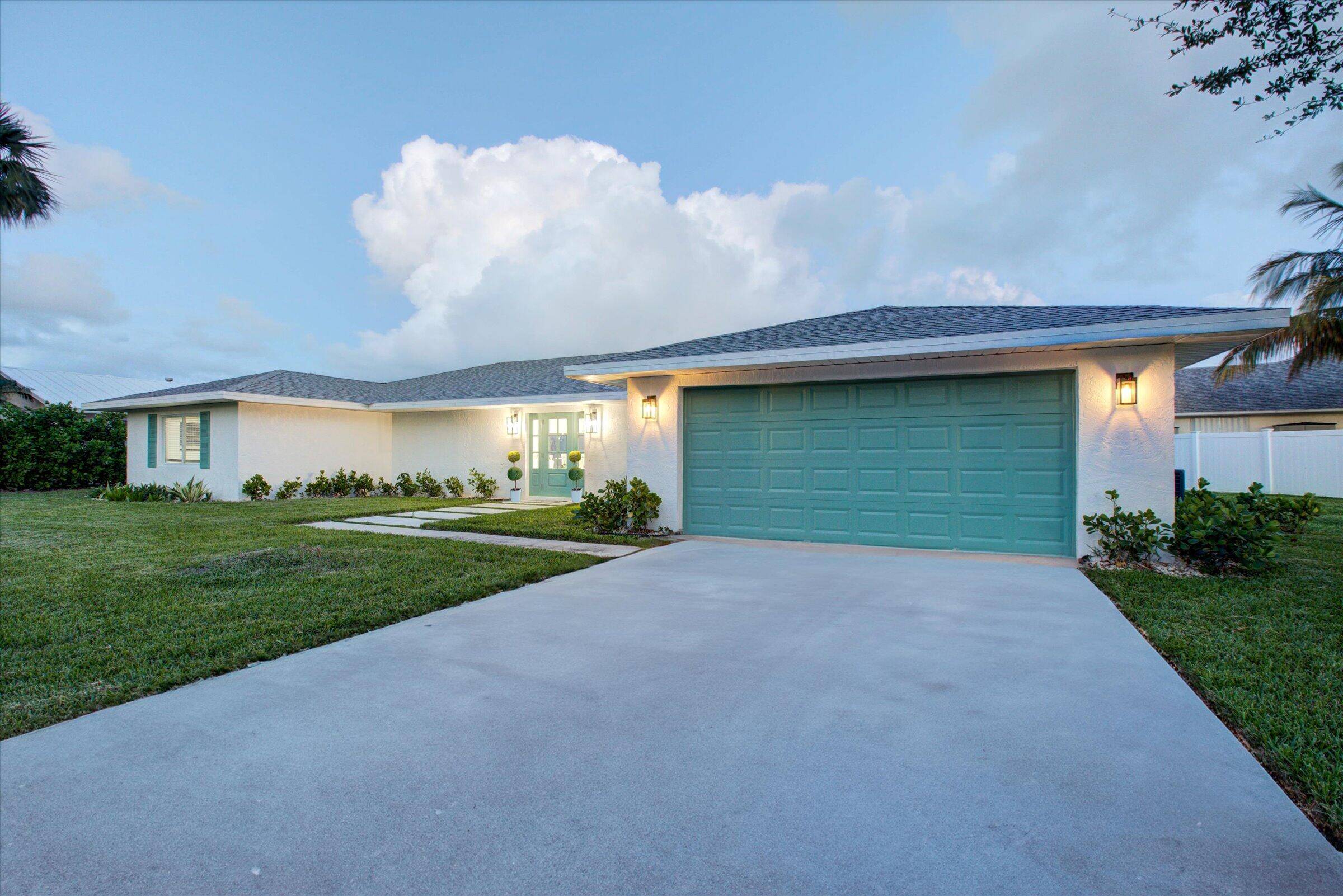 Come see this beautiful remodeled, intracoastal access waterfront home in the highly desirable Queens Cove community !