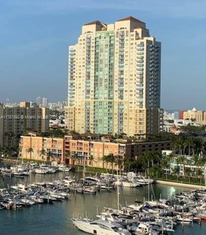 Rarely available South of Fifth town home offering the rare blend of single family home privacy and luxurious condominium amenities.