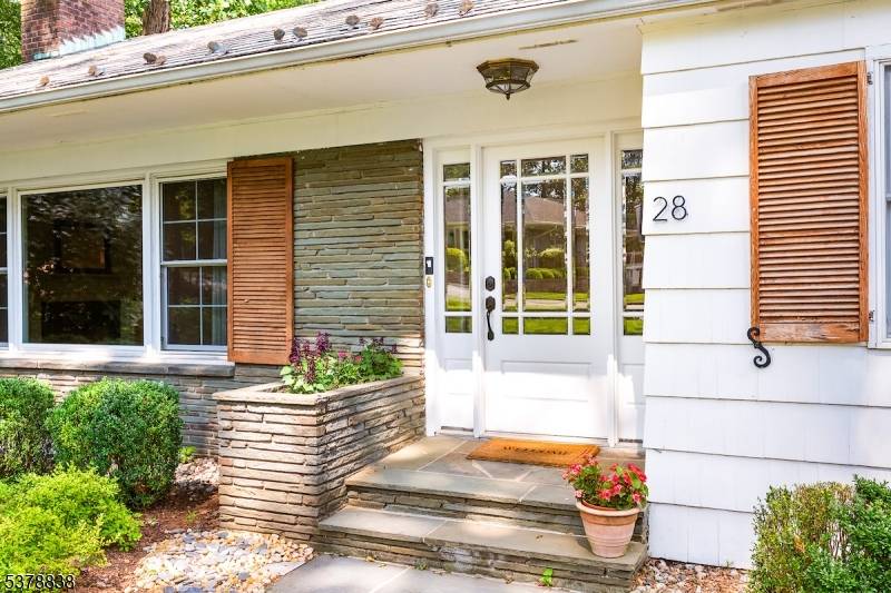 Open floorplan gem in tranquil setting with Reeves Reed Arboretum to side and rear of home.