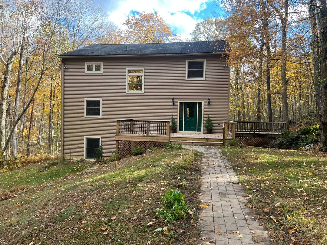 Tucked away on a long private road, this light and bright Roxbury retreat combines timeless character with modern comfort.