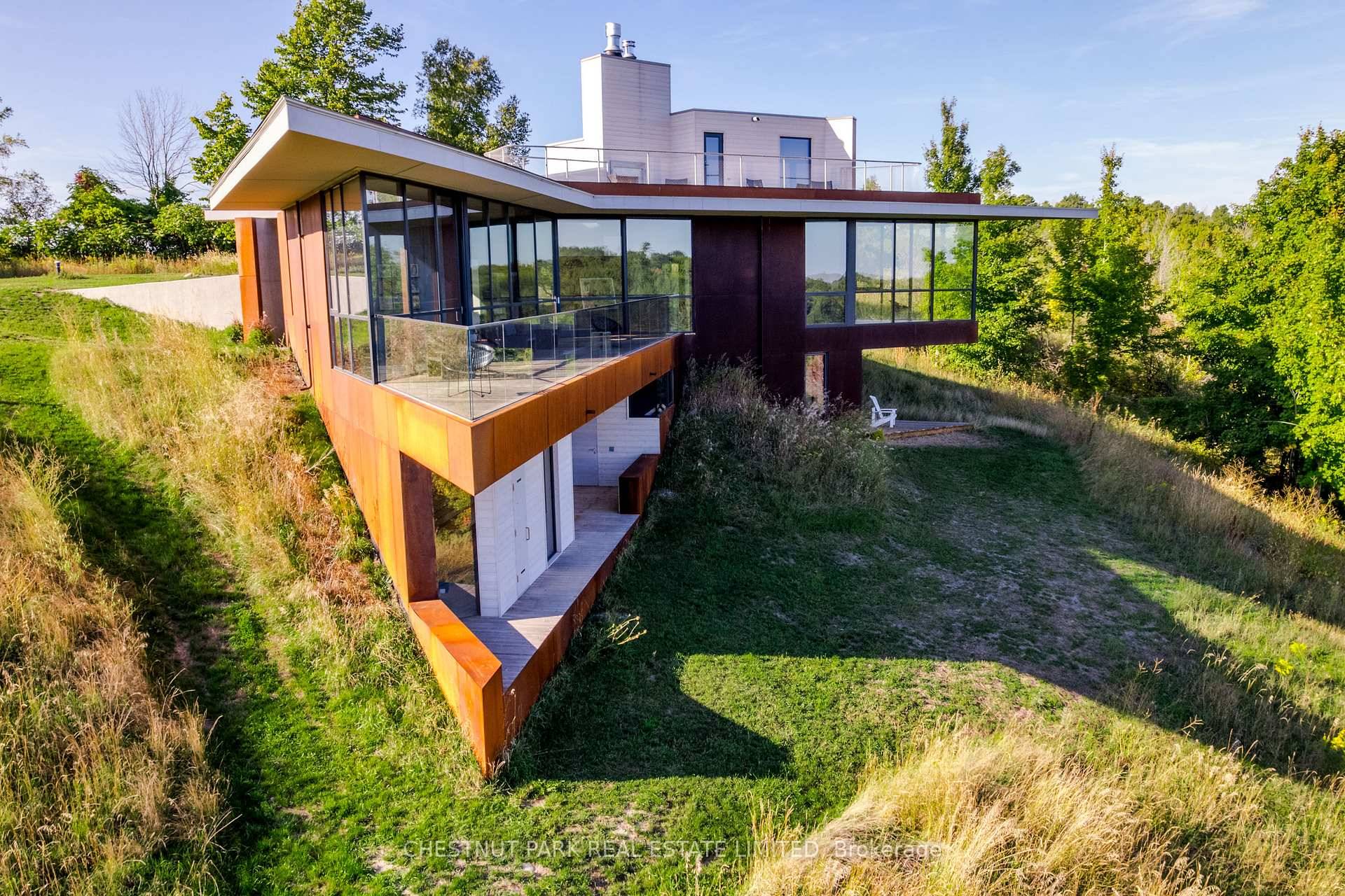 The Brillinger House. Architecture and nature harmonize in a magical setting with this stunning 2024 build, designed by Adam Thom.