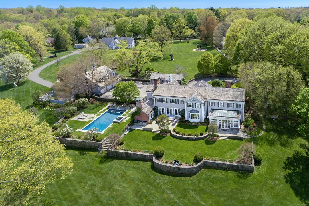 Welcome to 384 West Lane, an exceptional Estate Property that defines timeless Connecticut luxury across 13 exquisite, park like acres straddling Westchester County just an hour from NYC.