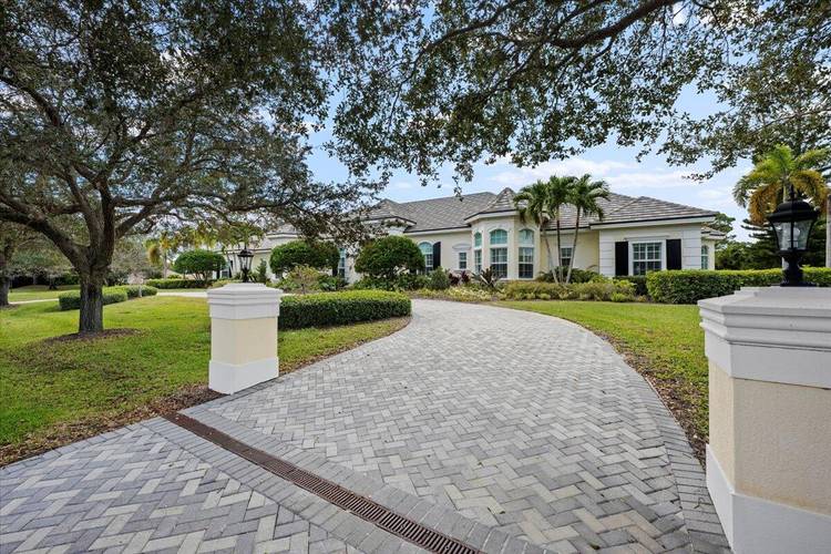 Welcome to 5775 Lady Luck Road, an exquisite property located in the tranquil Steeplechase community.