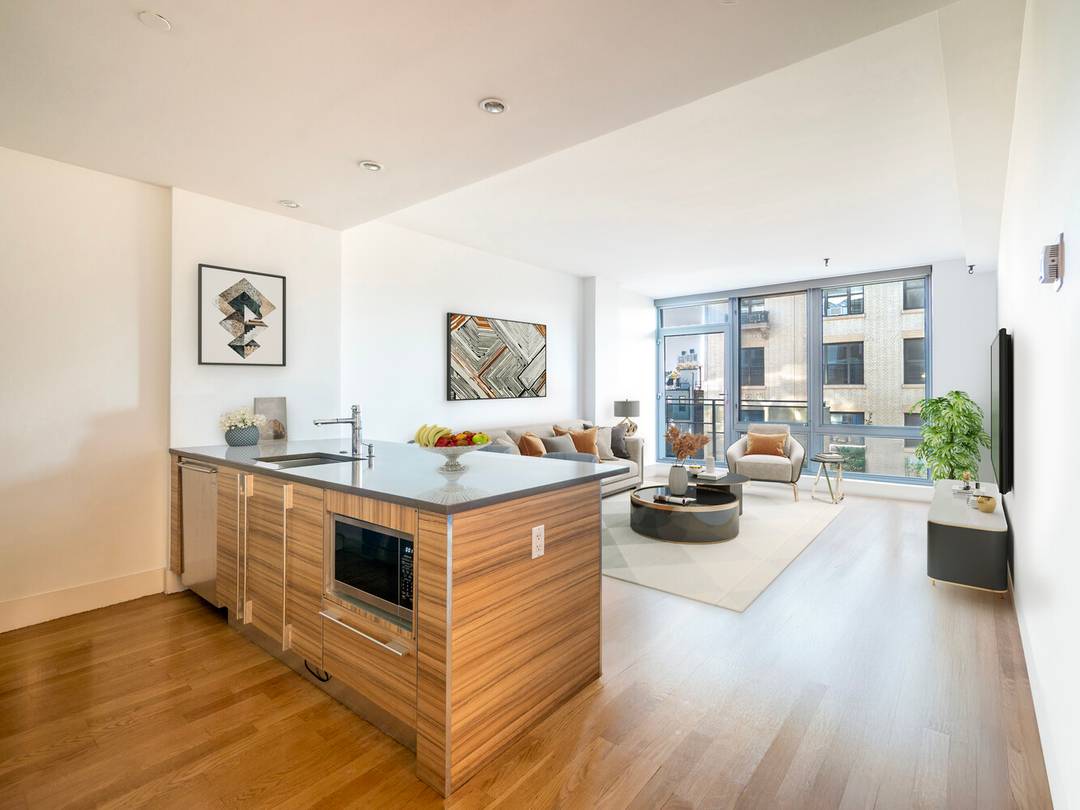 This beautifully proportioned two bedroom, two bath residence captures abundant southern light through floor to ceiling windows and glass doors that open to private balconies off both the living room ...