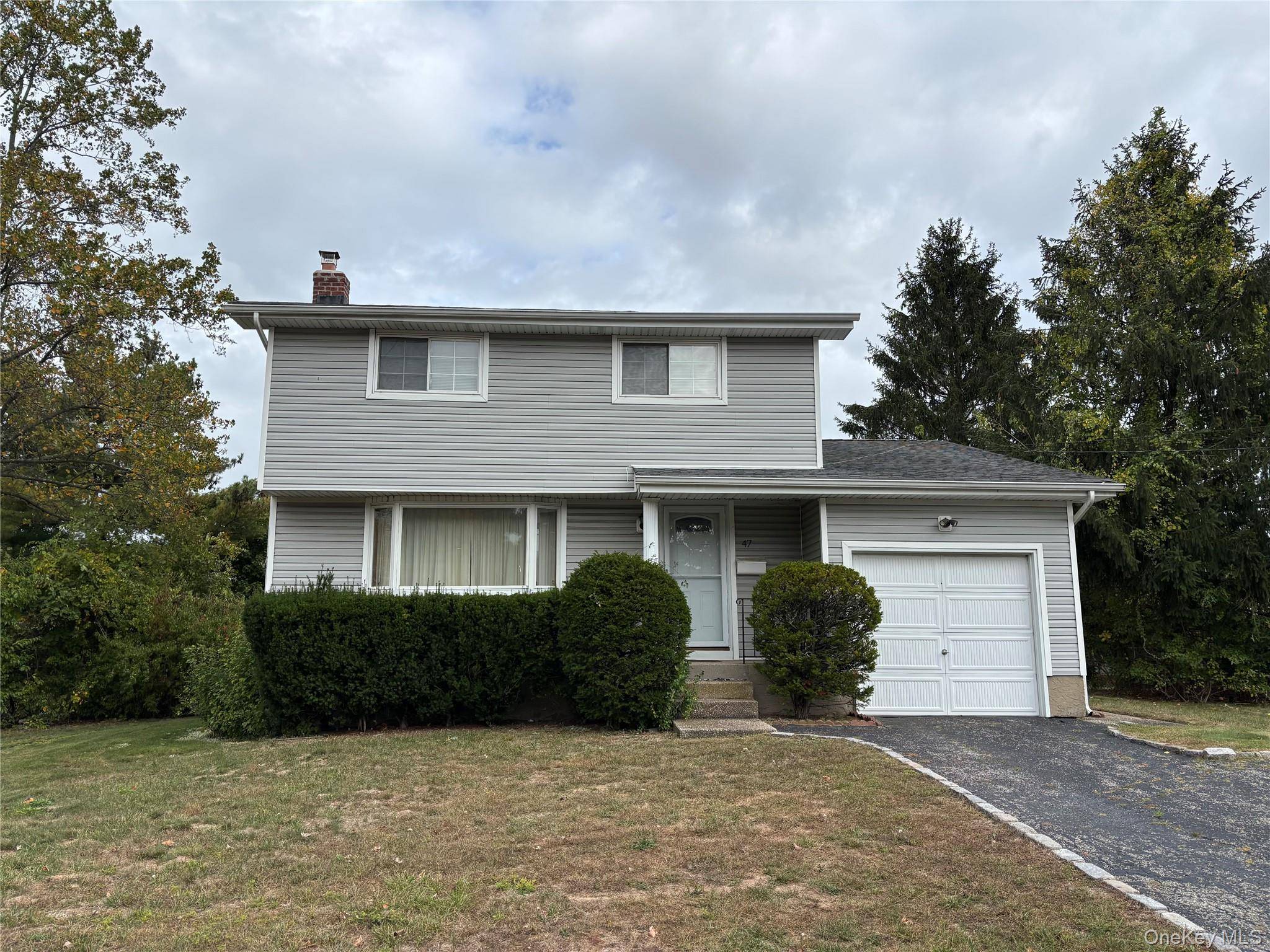 Solid and strong 3 bedroom, Colonial home with attached 1 car garage.