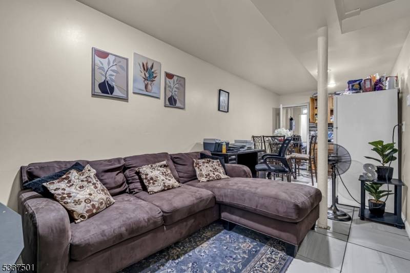 Welcome to this well maintained and income producing three family home located on a quiet, residential street in Irvington.