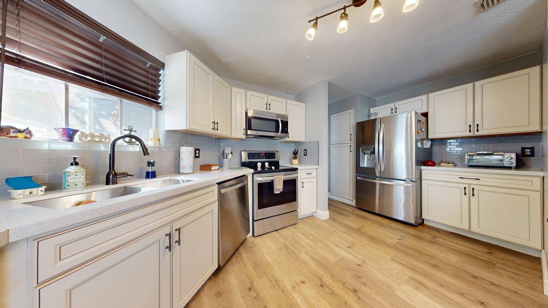 Step into this beautifully updated 3 bedroom, 2 bath single family home located in the serene, gated community of Victoria Woods.