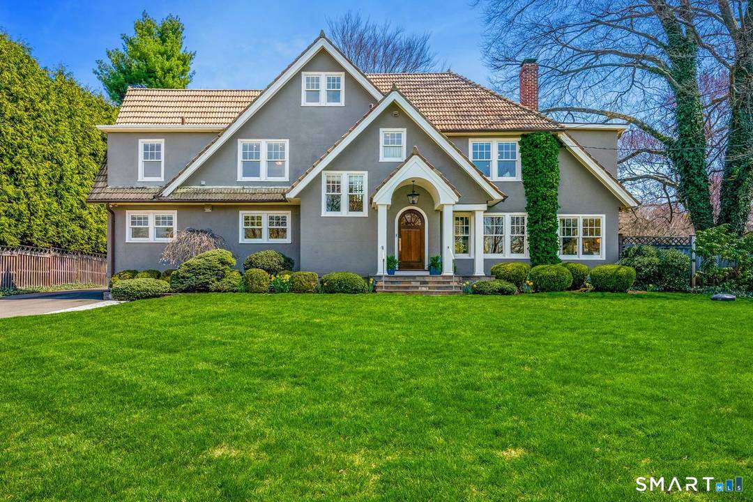 Masterfully renovated and expanded by renowned architect Chad Nehring, this 1929 Colonial features a chef's kitchen boasting a centerpiece 10' island, heated gunite pool, and seamless indoor outdoor living.