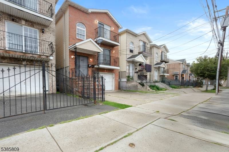 Welcome to 535 S 18th Street, a spacious and beautifully renovated three story two family home in Newark.