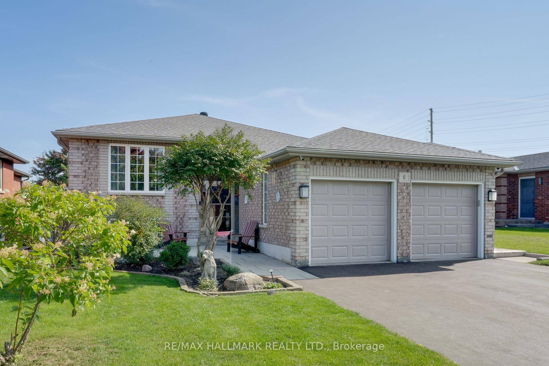 Renovated bungalow with walkout lower level, thoughtfully customized with downsizers in mind, featuring one primary bedroom on the main floor and two additional bedrooms in the walkout level.