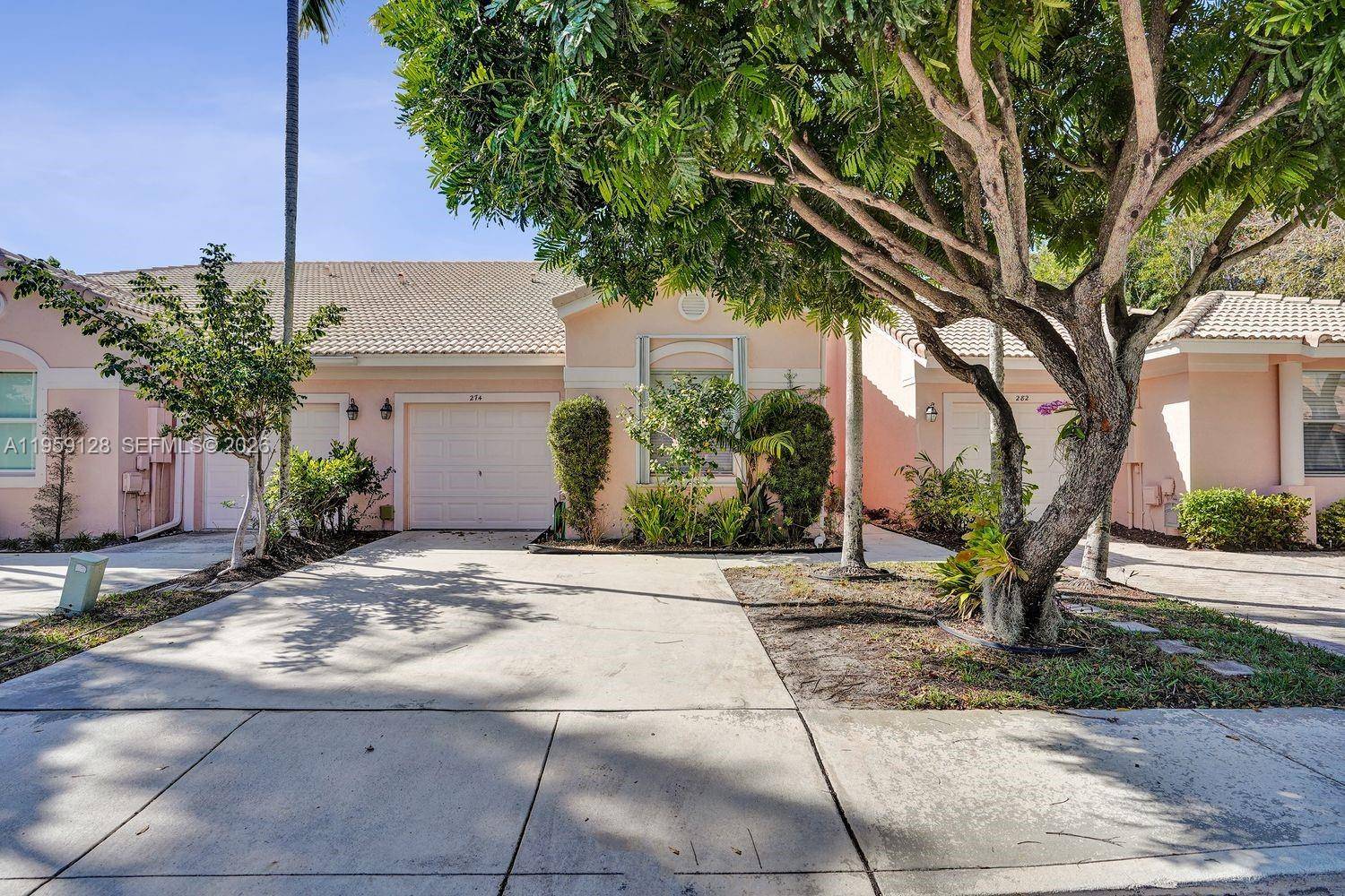 Step inside this inviting 2 bedroom, 2 bathroom split floor plan home in the desirable gated community of Coral Trace, just minutes from downtown Delray Beach.