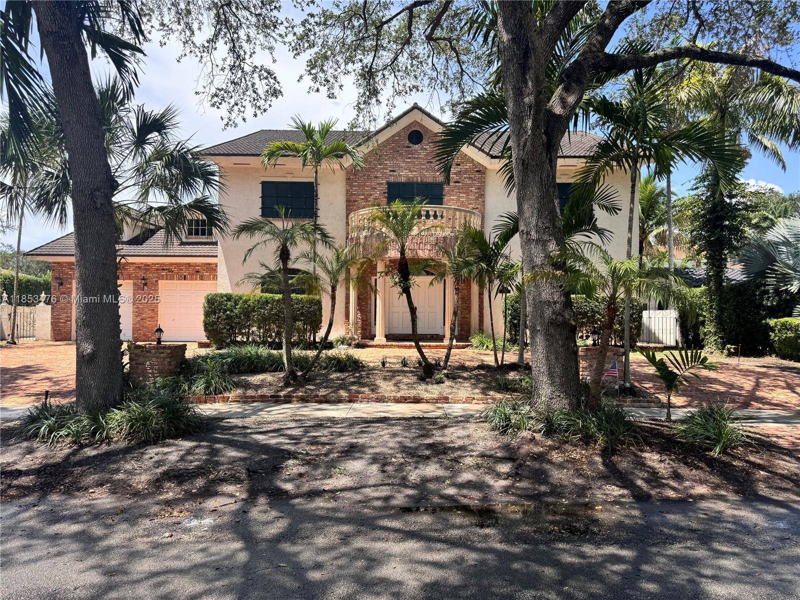 Timeless 4BR 4BA estate in Miami Lakes prestigious guard gated Loch Lomond community.
