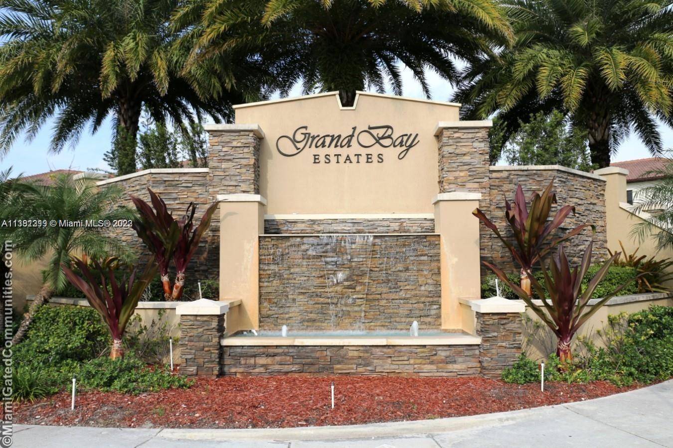 Beautiful single family home in the gated community of Isles of Grand Bay with four bedrooms and three 1 2 bathrooms.