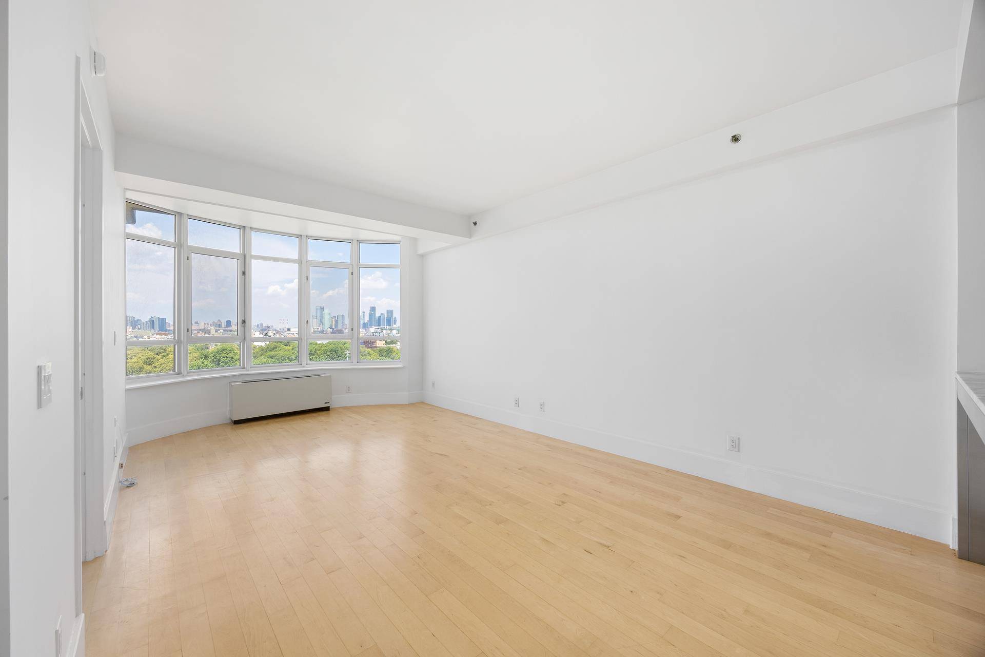 Perched high on the 11th floor of one of Williamsburg's most coveted full service condominiums, Residence 11D at 20 Bayard Street offers a rare combination of style, light, and breathtaking ...