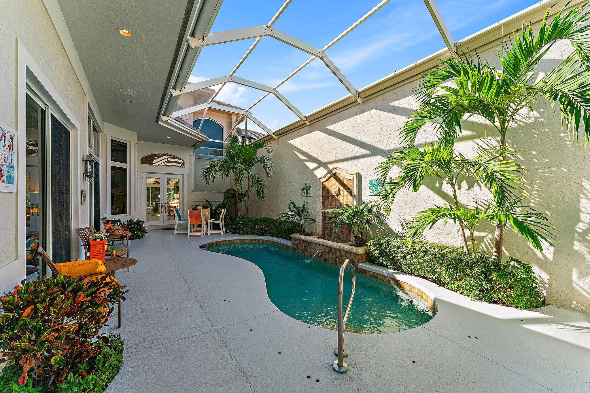 Located on the 8th hole of the Village Course in prestigious Jupiter Hills Village, this light filled two story townhome features 3 bedrooms, 3 full and one half baths, private ...