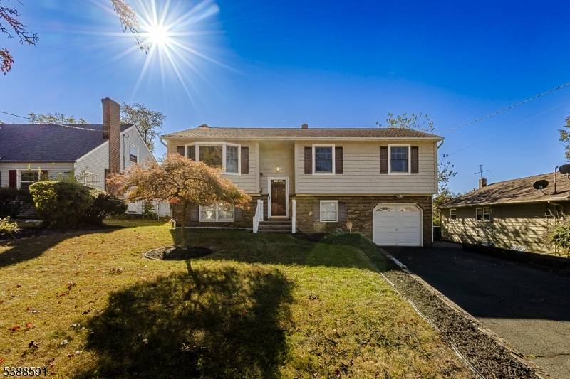 Spacious Bi level home with an updated kitchen and bath, woodburning fireplace in family room, 4 possibly 5 bedrooms, central air and heat and so much more.