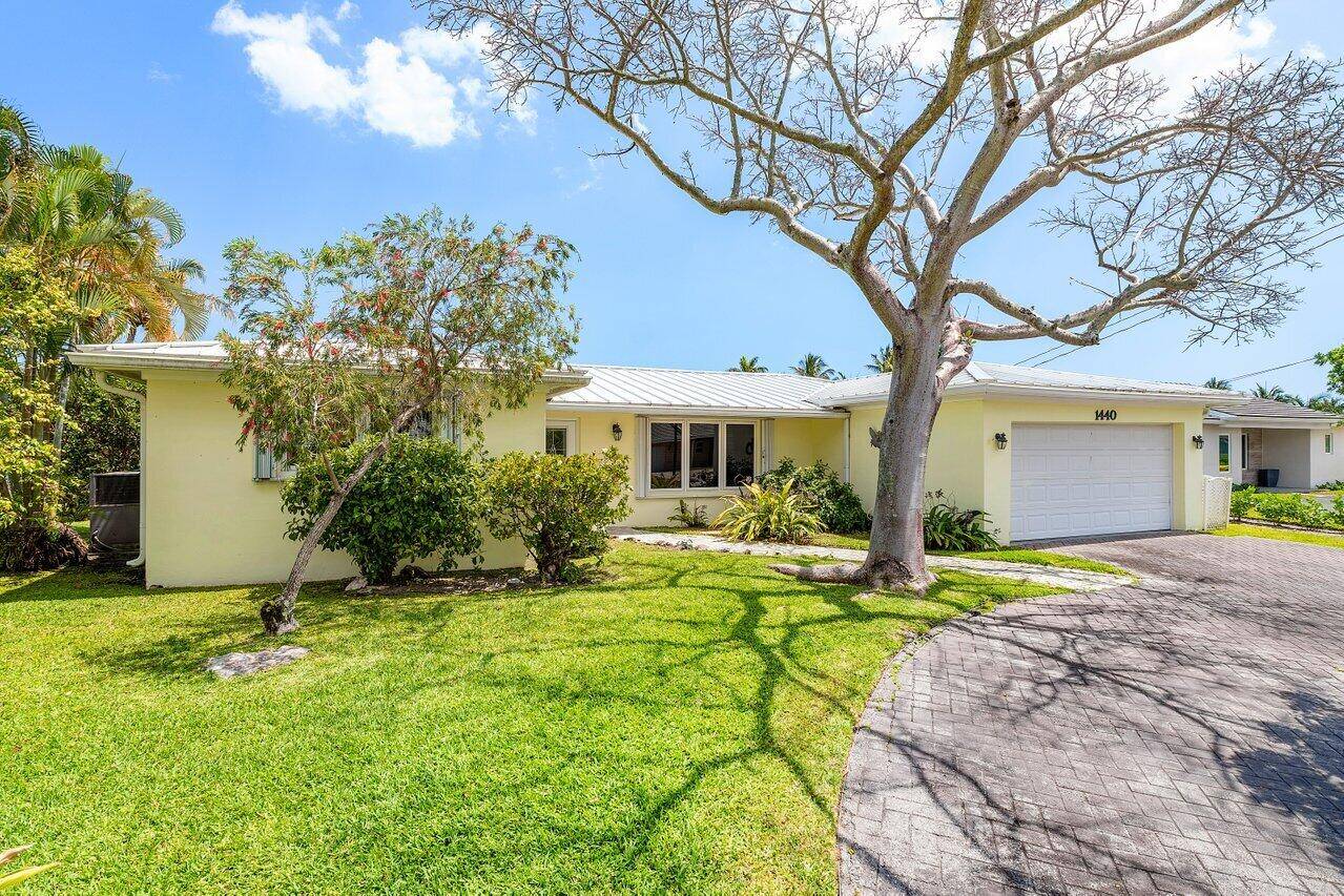 Beautifully updated one story waterfront home with private dock and heated salt water pool in sought after Boca Islands community of Boca Raton !