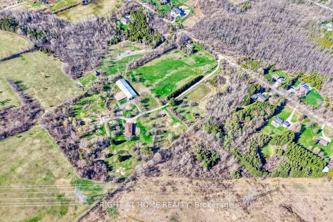 Welcome to this custom built raised bungalow farm property sitting on 21 acres of lush pastures.