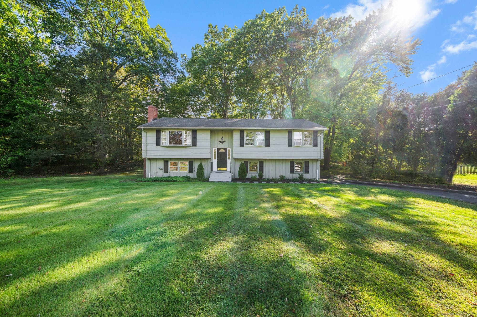 Welcome to this beautifully renovated raised ranch nestled on nearly an acre of land just minutes from Suffield Center.