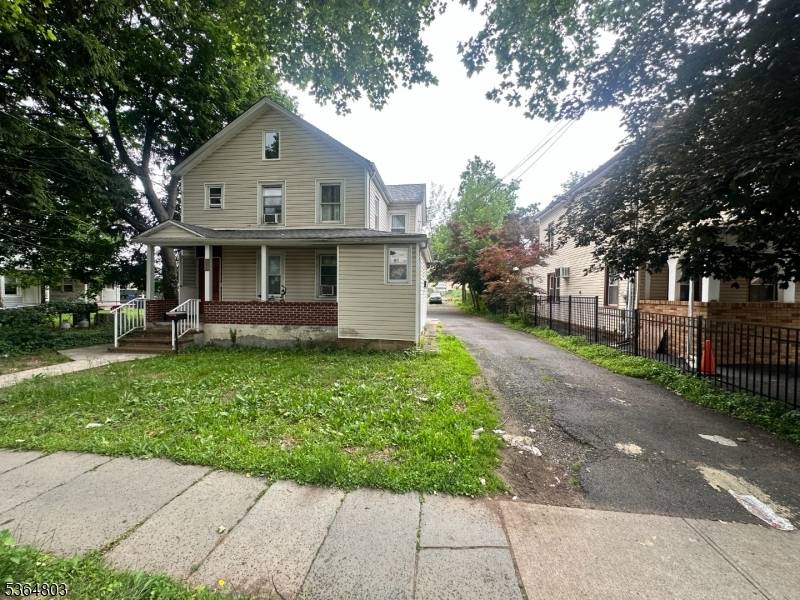 Updated kitchen, newer bathrooms, hardwood floors, large backyard parking for 8 cars, near public transportation