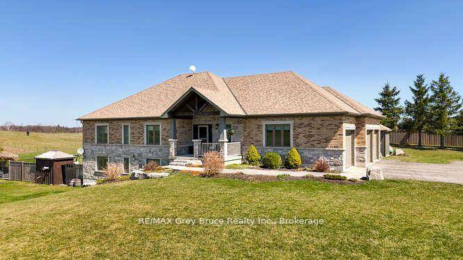 This magnificent custom built Bungalow with attached 3 car garage sits on over 2 acres.