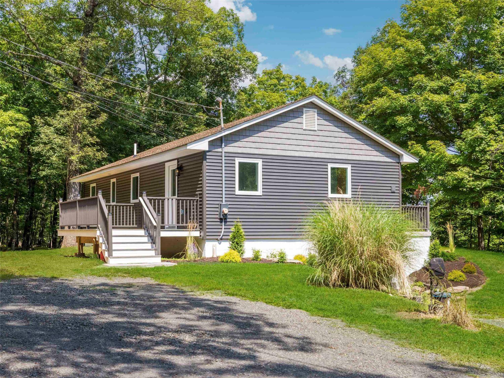 Welcome to your dream home, nestled in the serene landscape that perfectly balances country charm with modern convenience.
