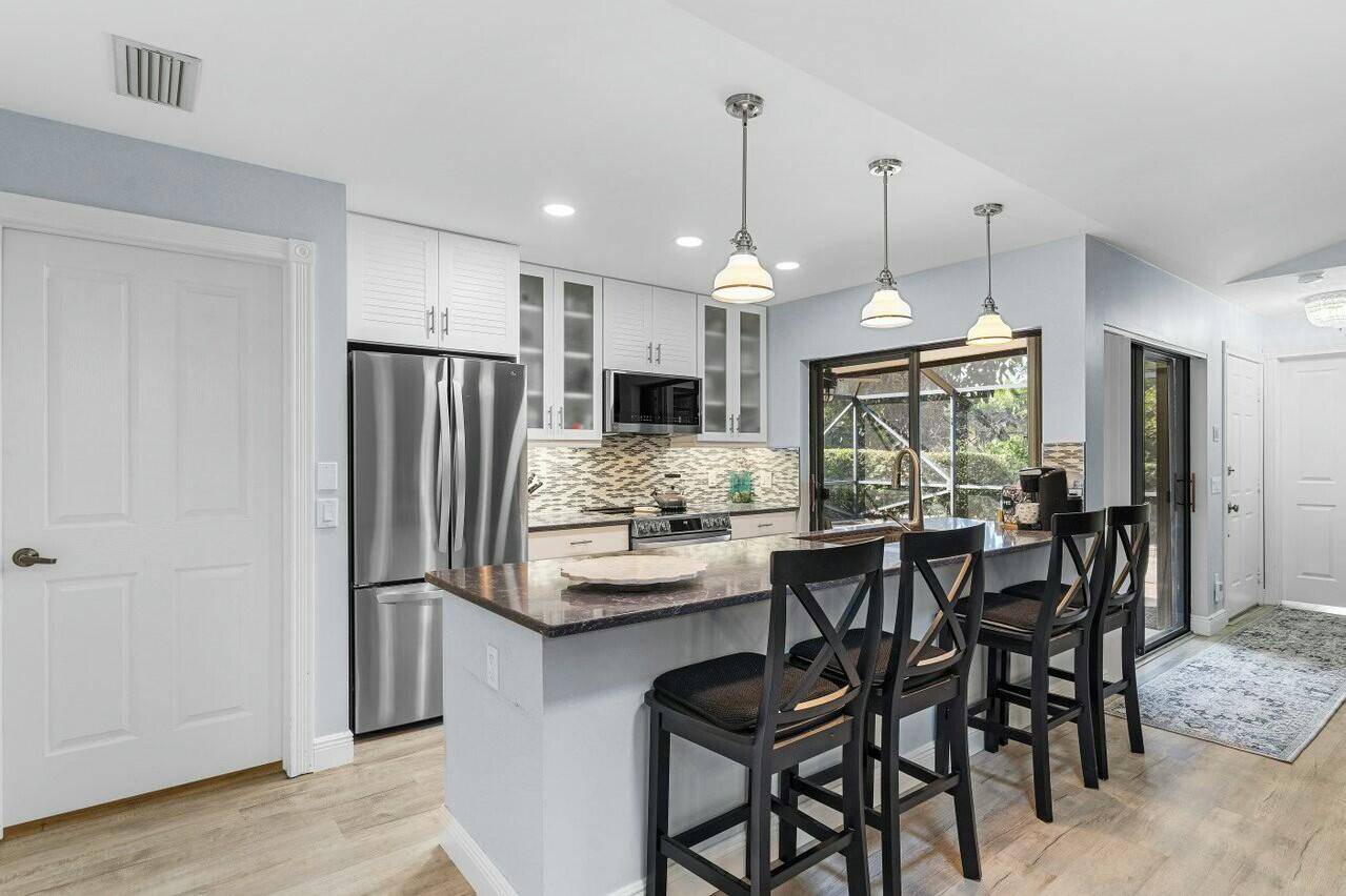 Don't miss out on this beautifully remodeled Divosta built villa in the highly sought after Jefferson Corners at Heritage Ridge !