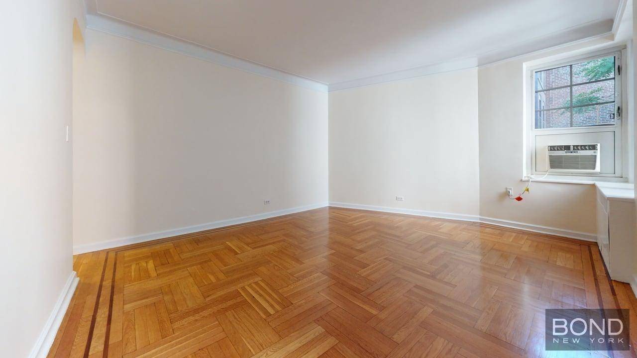Massive studio features large living space, separate kitchen with stainless steel appliances and a dishwasher, windowed bathroom, hardwood floor and high ceilings.