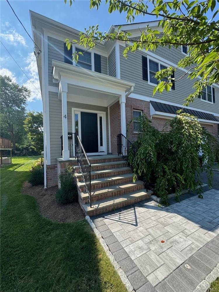 Experience luxury living in the heart of Harrison with this bright and spacious duplex unit.