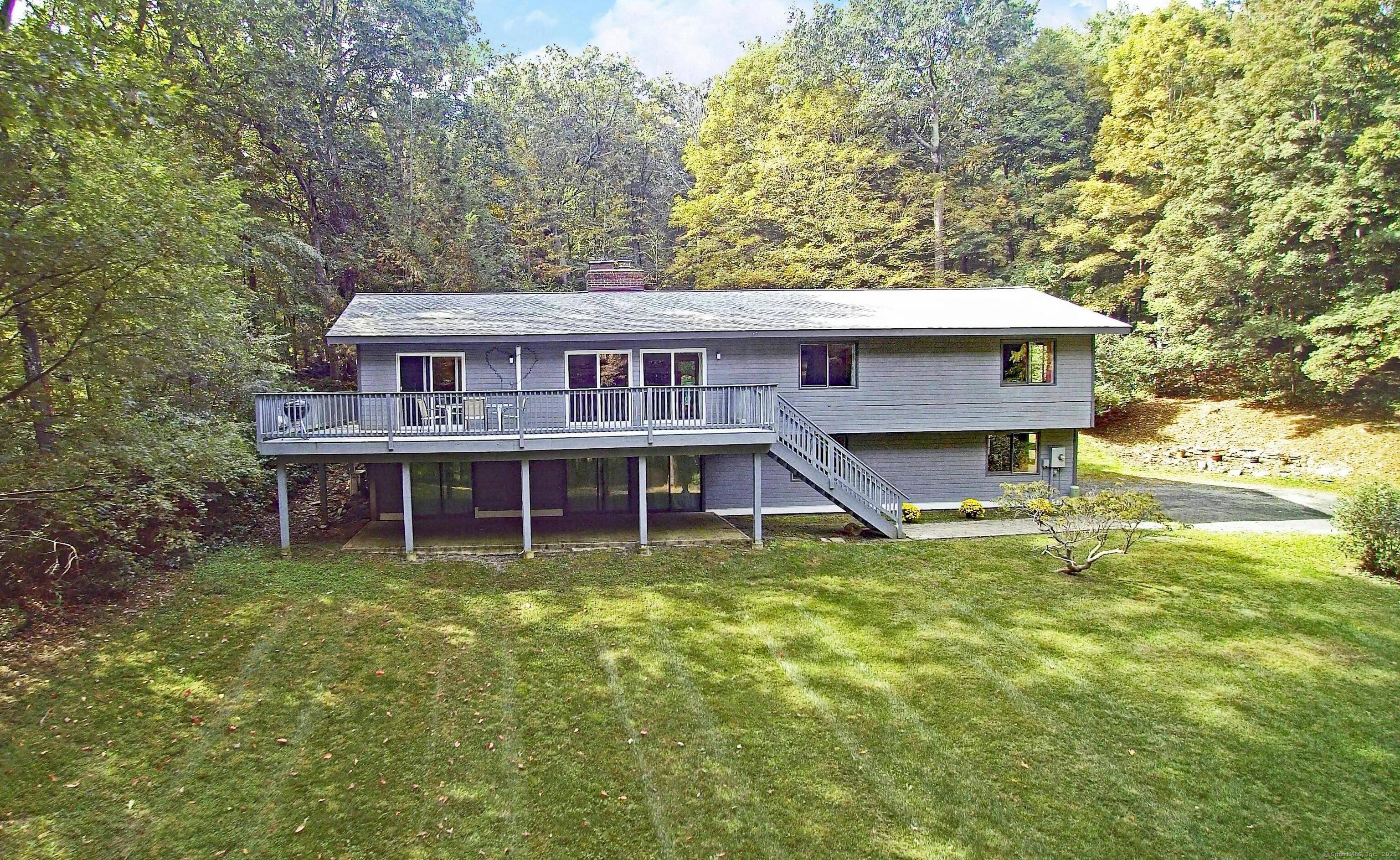 Sophisticated mid century inspired modern deck house in the sought after Umpawaug area of West Redding, set back on 4 private acres with scenic views of the neighboring pond.