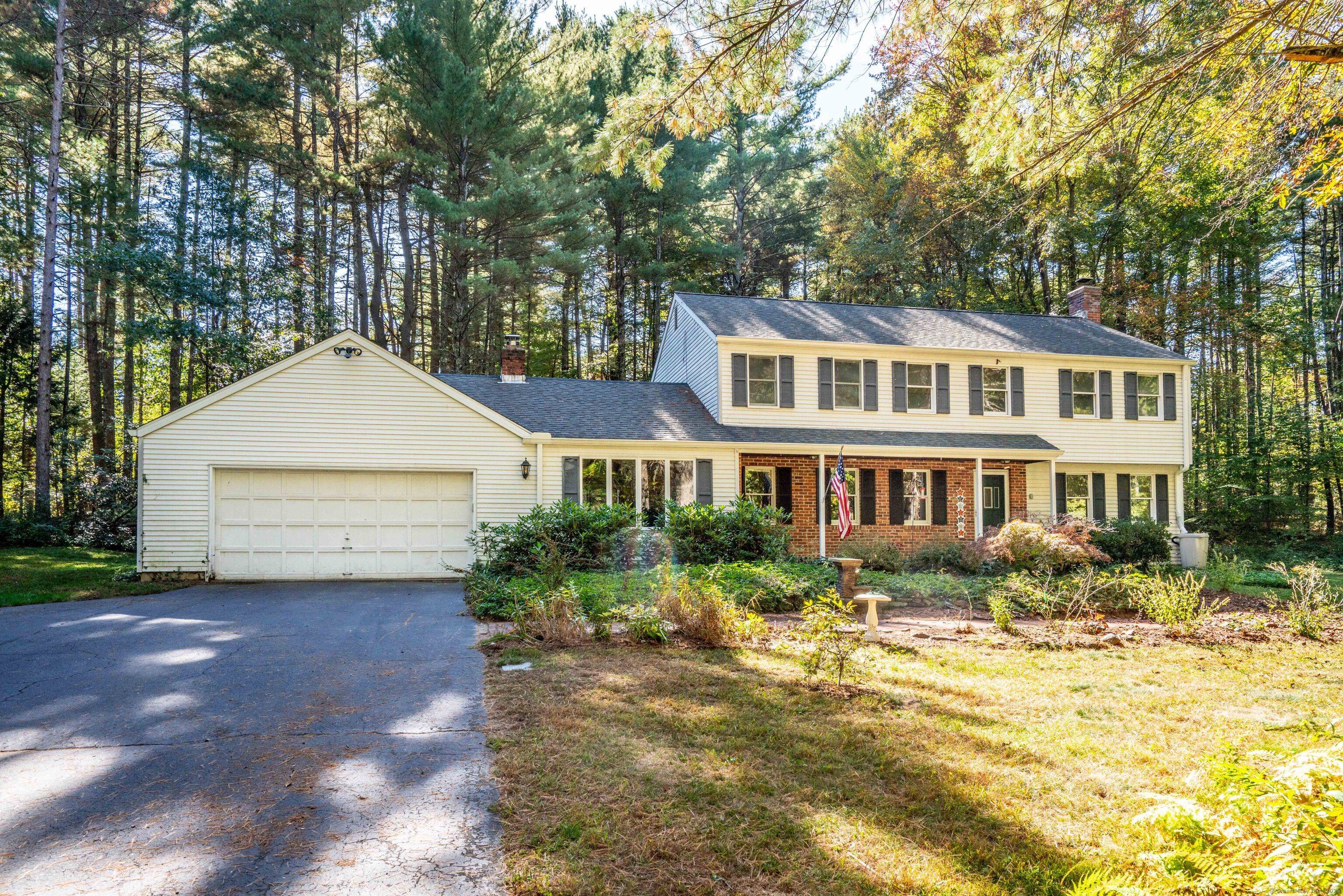 Welcome home to this classic 4 bedroom colonial set on a private lot in the desirable Fox Den neighborhood of West Simsbury.