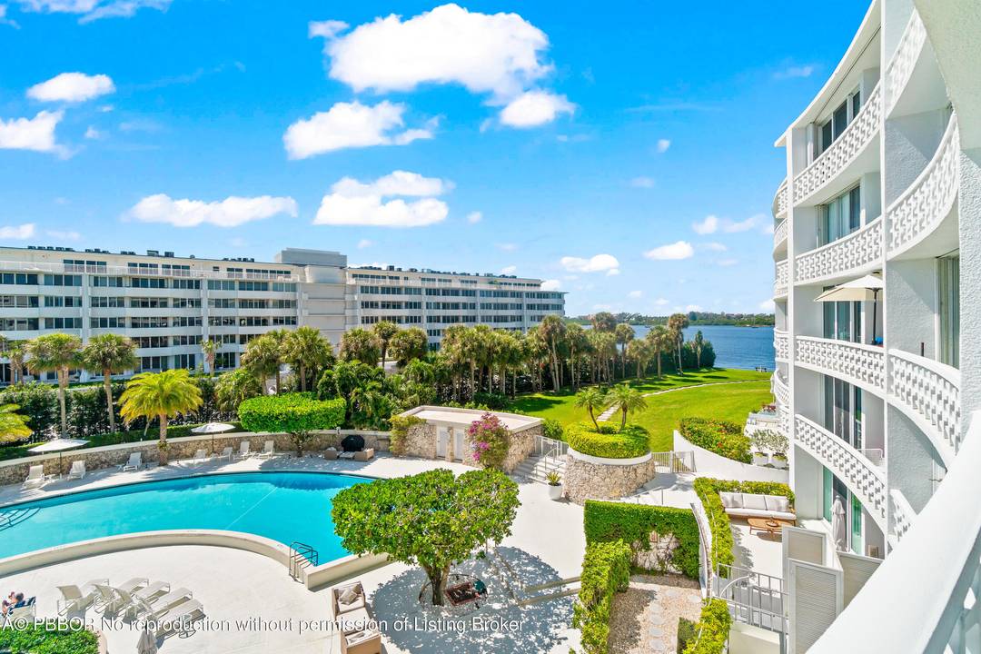 This sun filled tastefully renovated apartment features large white tile floors, a stylish kitchen, and a modern bath in elegant neutral tones.