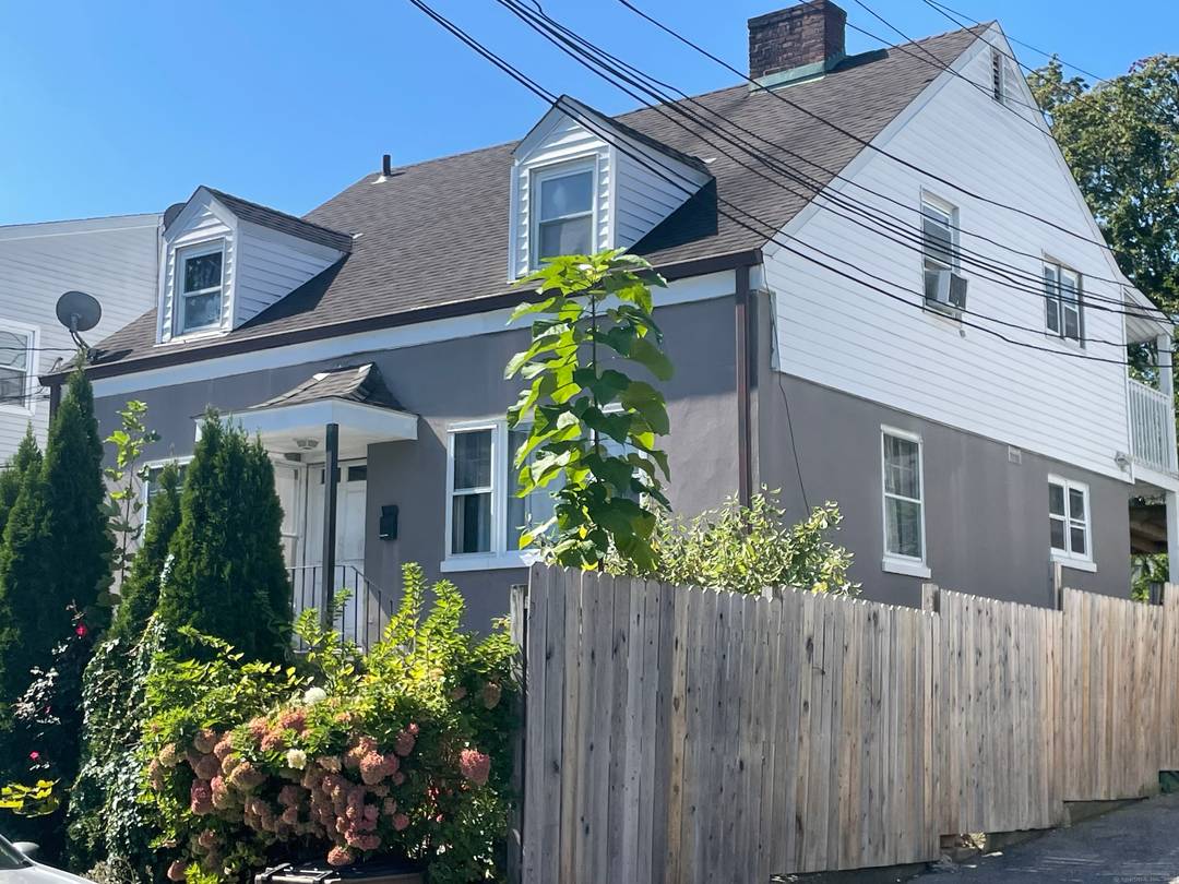 2Family Multifamily in Stamford 1st Unit is middle and bottom floor w attached garage 2 br, 1 bath on middle floor 1 br, 1 bath on bottom floor.