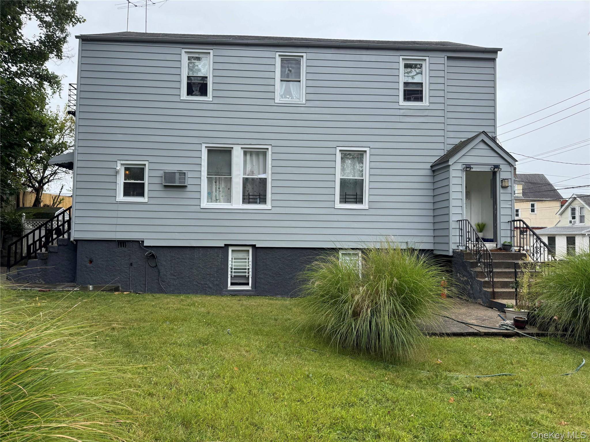 Two Family with Bonus Basement Room.