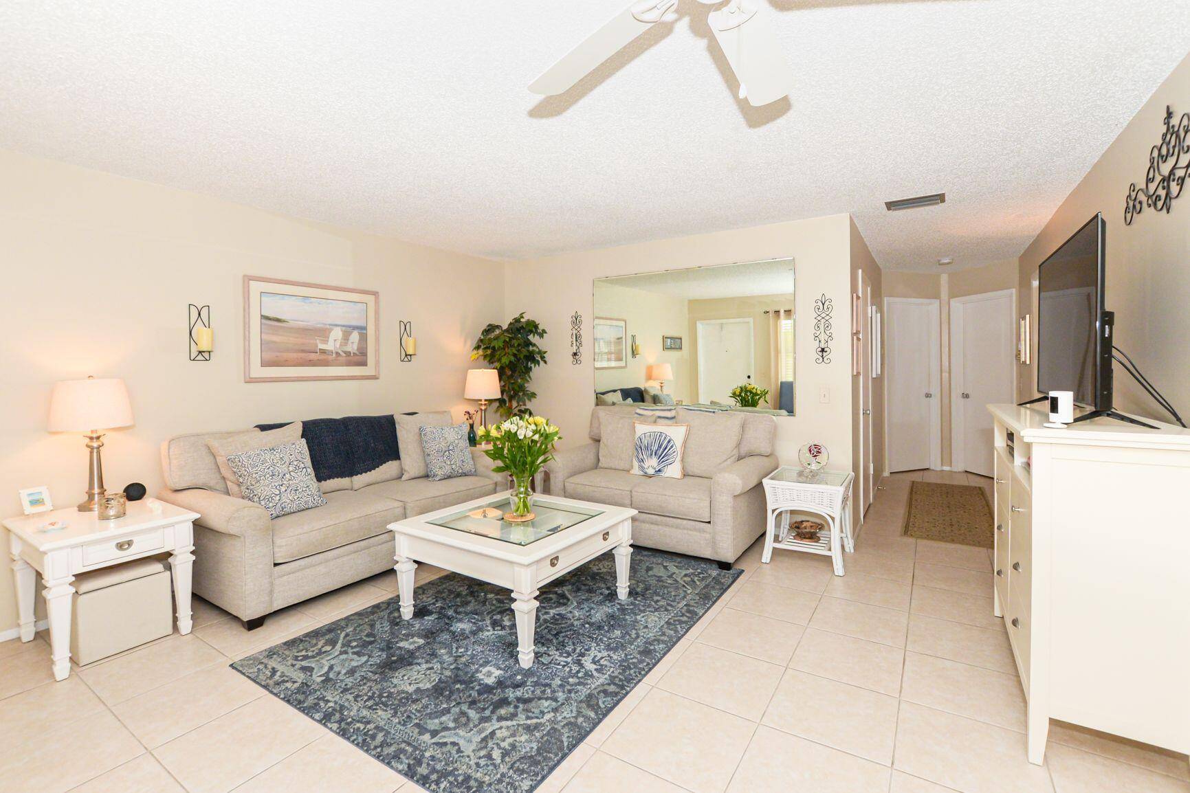 Beautifully renovated and maintained, this 2nd fl Condo has All Impact Glass Windows, including Sliders to the back Lanai.