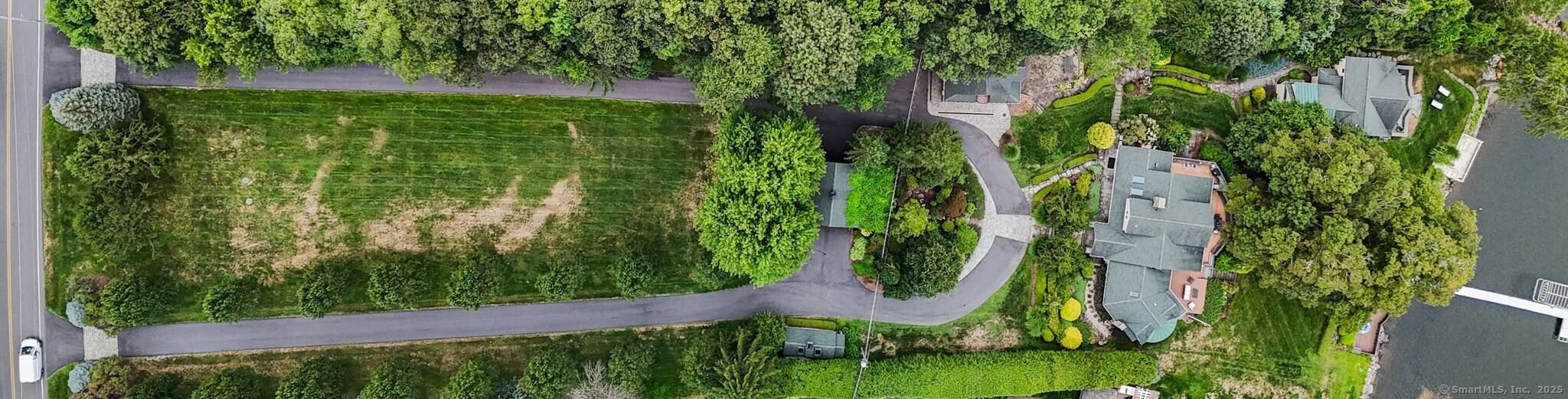 Lakefront estate consisting of 2 separately deeded properties set on 2.