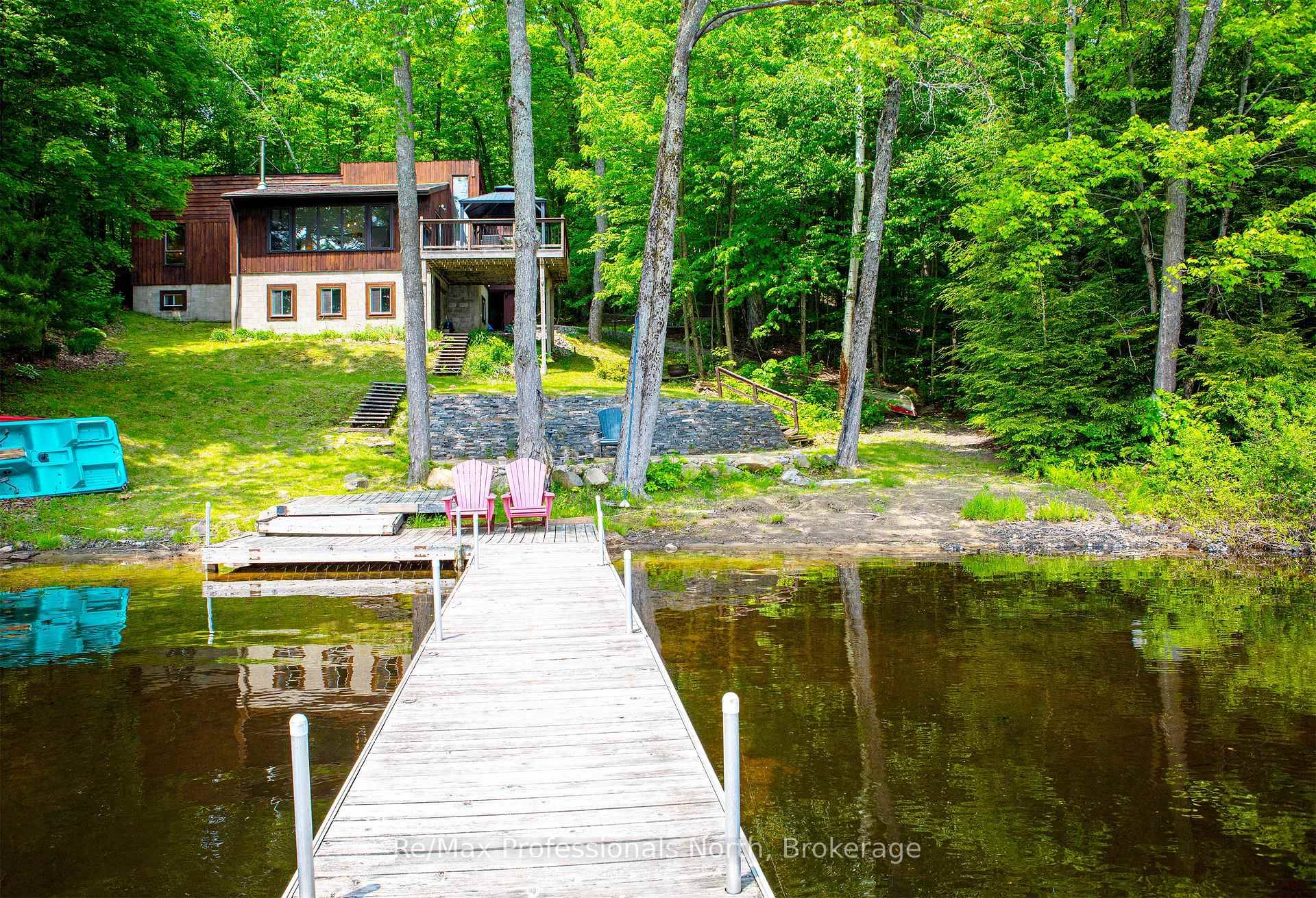 Bird Lake cottage, sand beach with shallow entry, expansive view from the deck onto the waterfront.