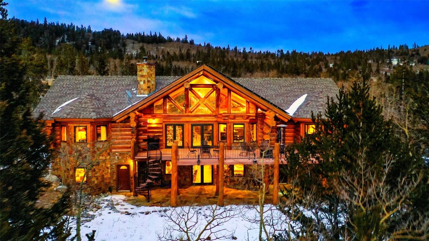 Luxurious, custom full round log and stone home comes fully furnished and is well appointed throughout.