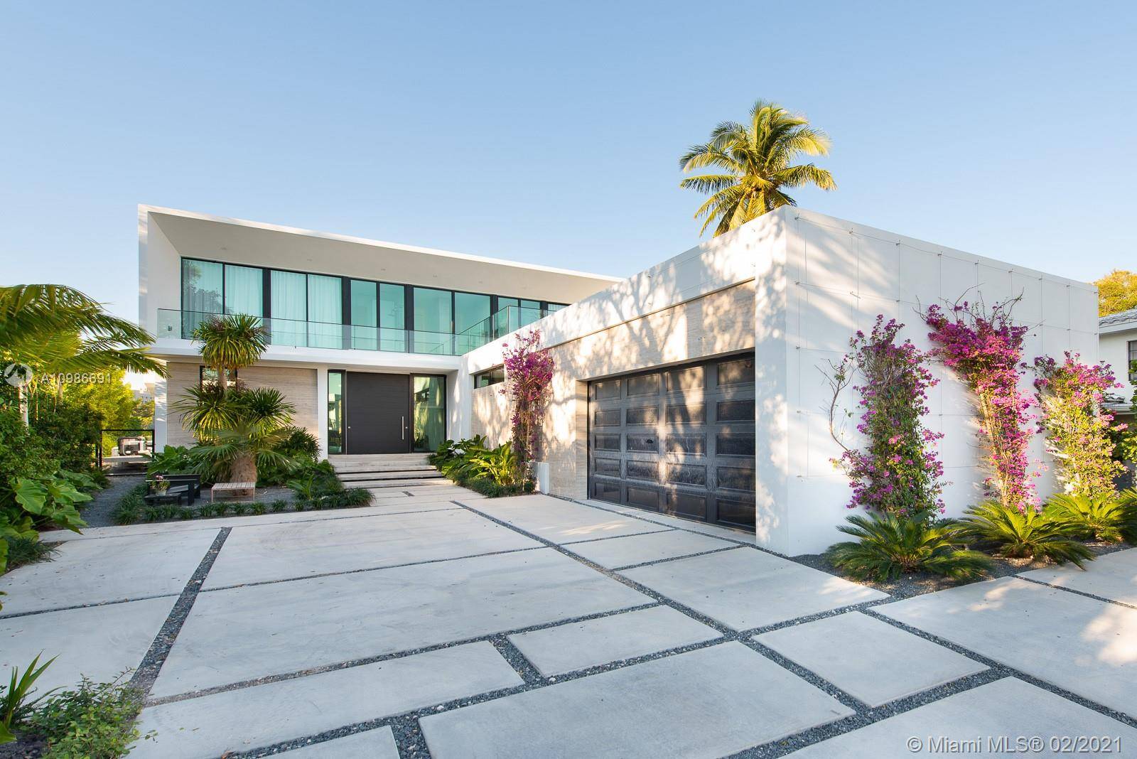 Located on the prestigious and sought after North Bay Road, this stunning new construction home offers tranquil canal views.