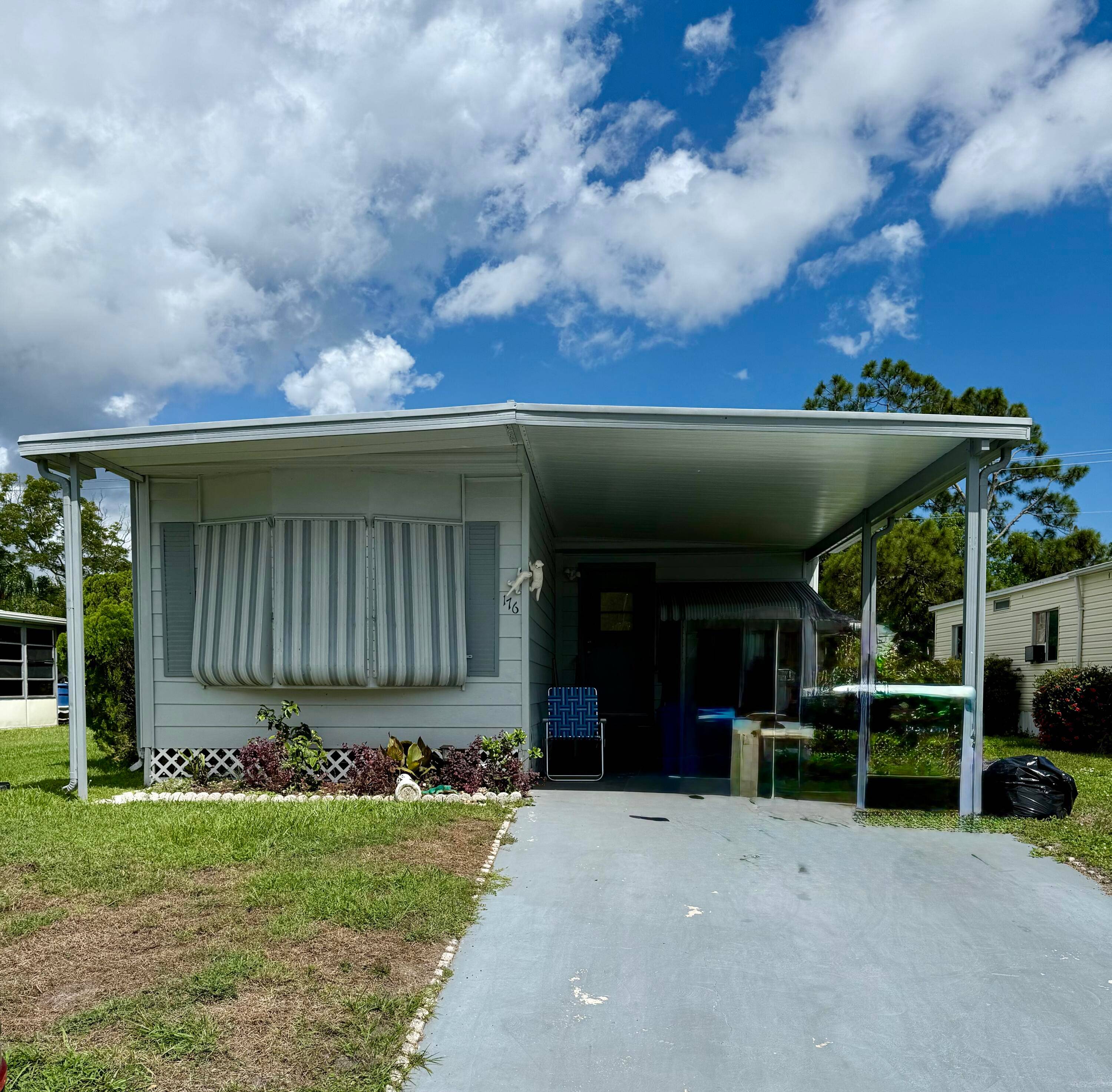 Welcome to 176 W Caribbean a beautifully maintained 2 bedroom, 2 bath home located in the highly desirable Pet Section of 55 Spanish Lakes Golf Village.