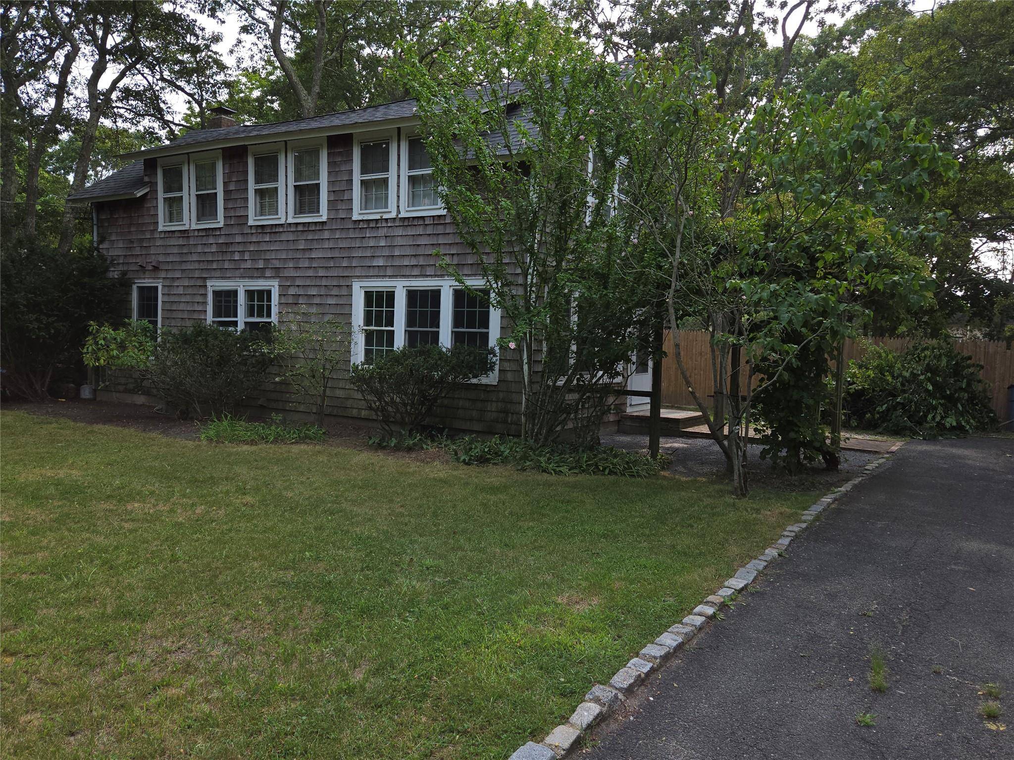 Westhampton Beach Village location offers Beach Access from this legal two family home, 3 bedroom 2 bath downstairs with fireplace and washer dryer.