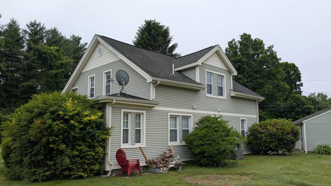 Property includes a 2 family home and a 40' x 80' steel building.