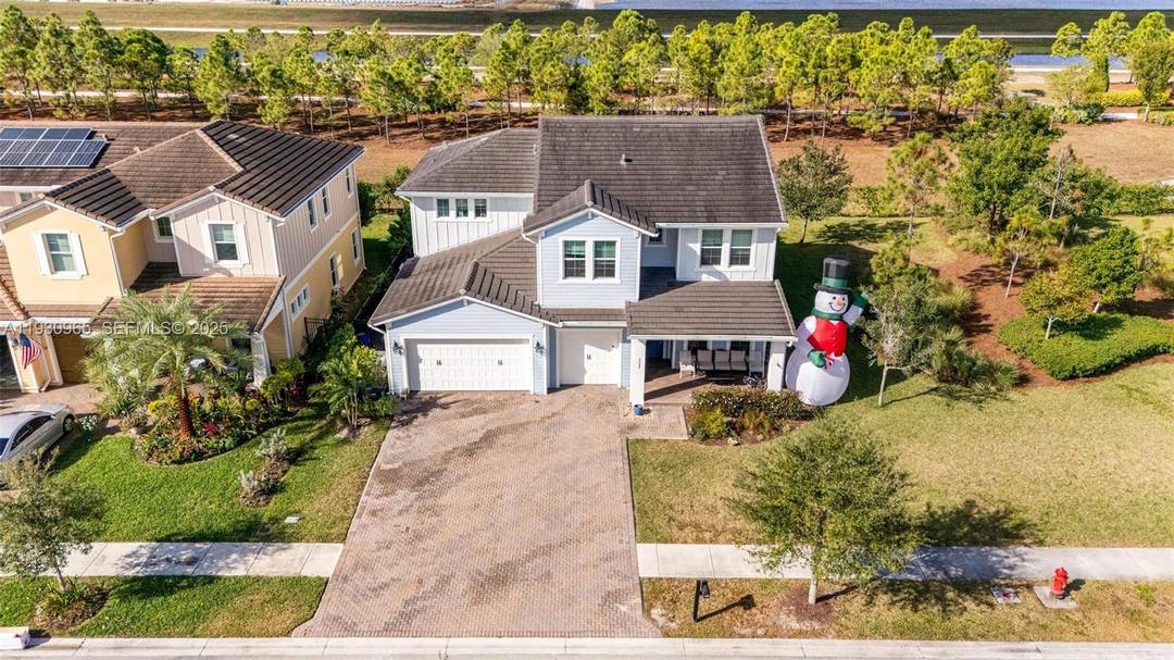 Welcome to this beautifully upgraded model home, one of the largest floorplans, offering 3, 361 square feet of living space in the highly sought after Arden community of Loxahatchee, Florida.