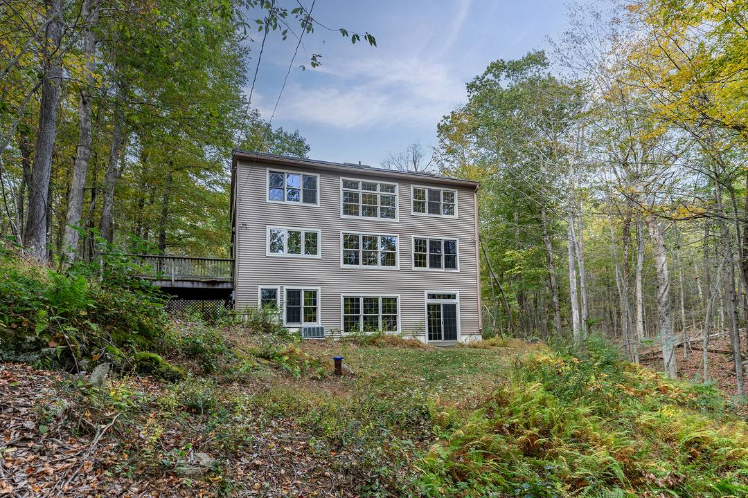 Tucked away on a long private road, this light and bright Roxbury retreat combines timeless character with modern comfort.