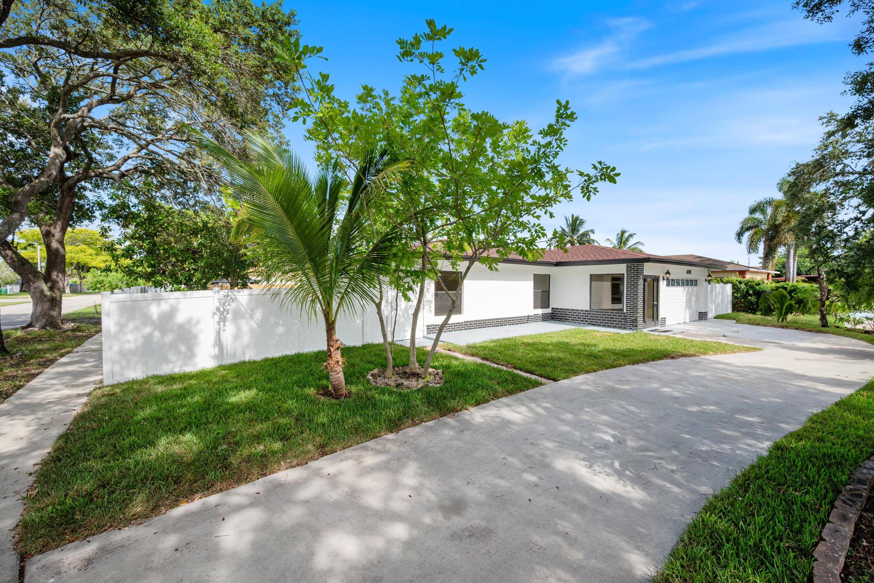 FULLY RENOVATED 4 BED, 3 BATH CORNER LOT HOME WITH IMPACT GLASS, 2 CAR GARAGE CIRCULAR DRIVEWAY !