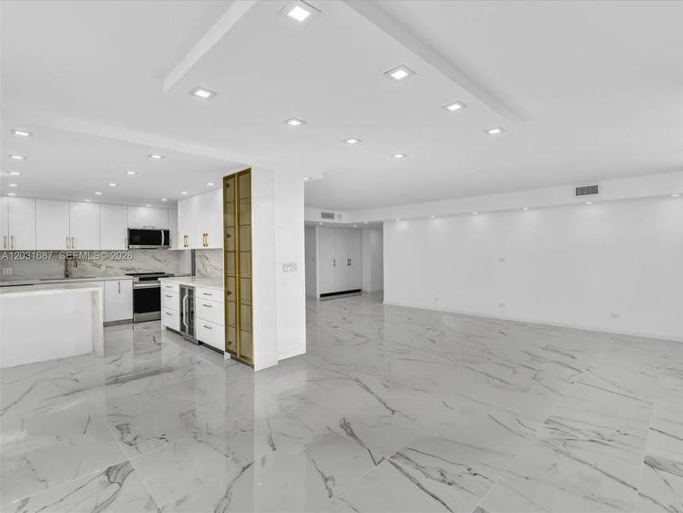 Step into luxury living in this fully remodeled corner 2 bedroom, 2 bath residence featuring the largest 2 bedroom floor plan in the entire Winston Towers community.