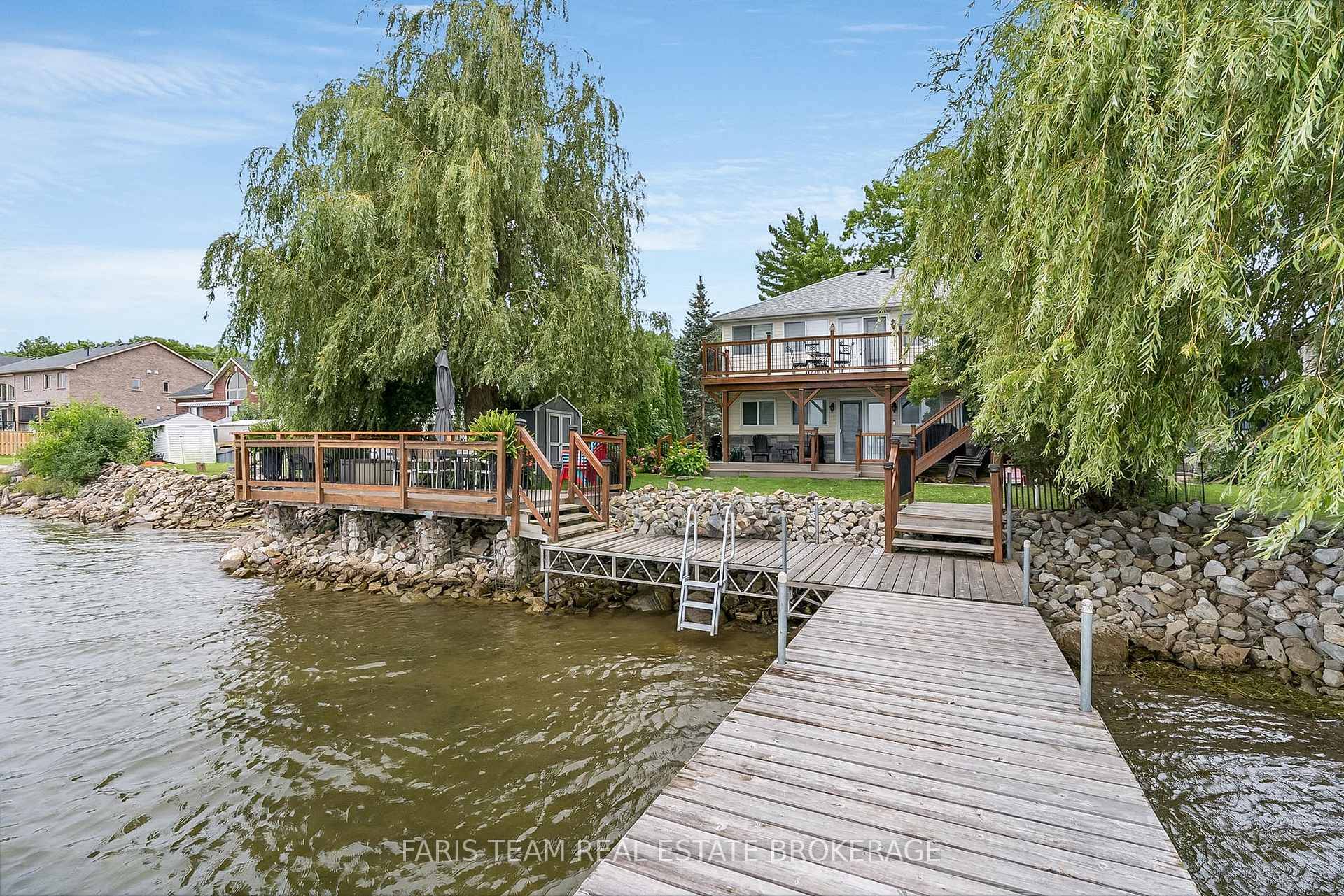 Top 5 Reasons You Will Love This Home 1 This waterfront home showcases breathtaking panoramic water views, creating a tranquil and scenic atmosphere enjoyed from multiple rooms throughout the house ...