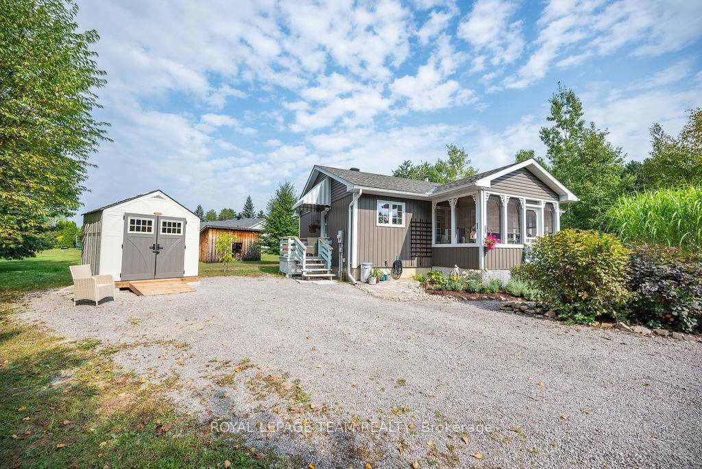 Set back from the street, beautiful gardens, fruit bearing trees amp ; oasis like landscaping welcome you home.