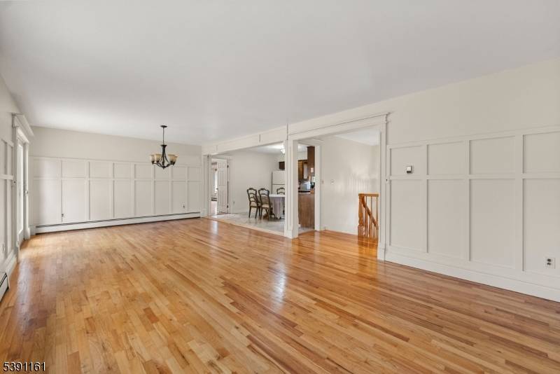 This impressive four bedroom office custom brick home offers exceptional space and versatility, featuring living areas and a full kitchen on each level ideal for guests or extended living.