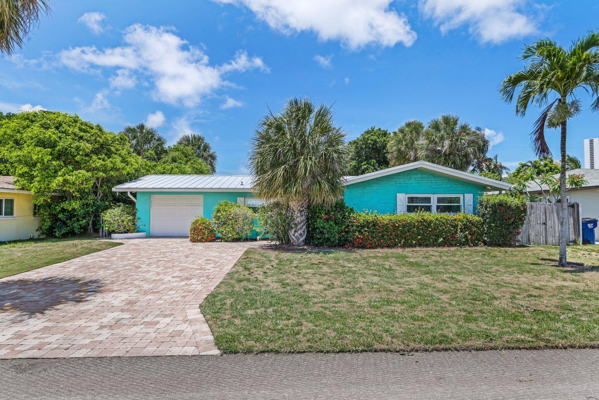 Welcome to this stunning 3 bedroom, 2 bathroom single family home in Singer Island, just under half a mile from the beautiful ocean and Intracoastal Waterway.
